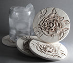 hand carved rose design with ice water glass absorbing condensation